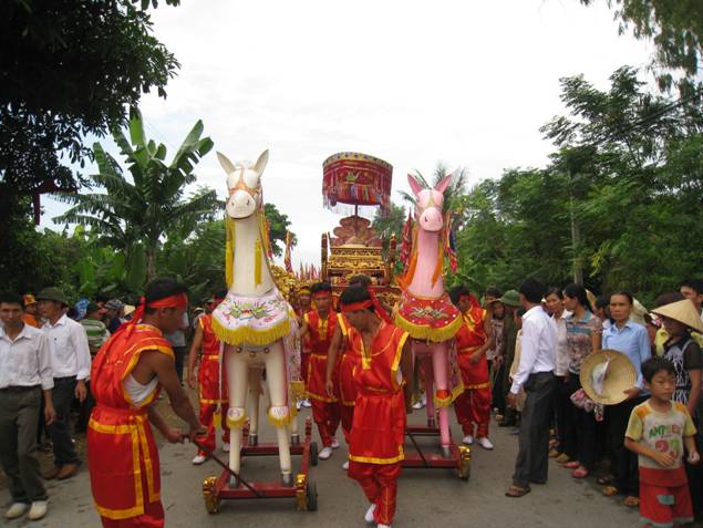 A group of people in red and yellow outfits

Description automatically generated